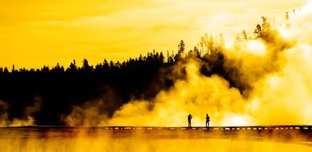 Silhouette of people photographing person steam geysers steamの写真素材