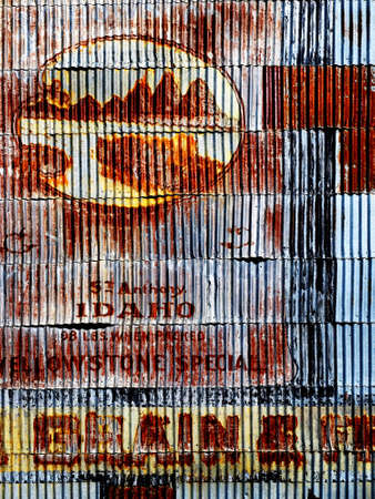 Old signs on wall of steel building of grain siloの写真素材