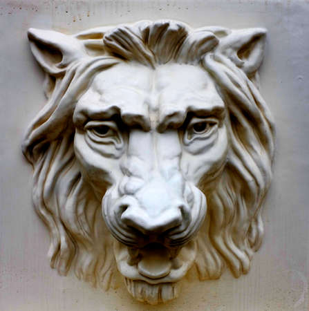 Detail of motiff sculpture carving of lion head in marble or stoneの写真素材