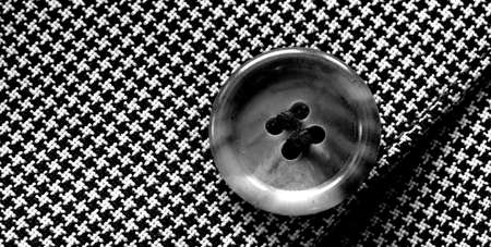 Detail closeup close-up of suit button hole fabric on sleeve of blazer jacketの写真素材
