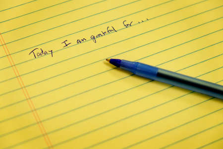 Gratitude notebook with pen writing today I am grateful forの写真素材