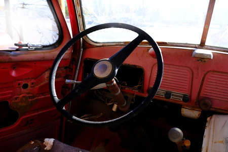 Detail of steering wheel in old vintage car truck horn and gear shift interiorの写真素材