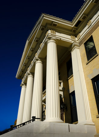 Detail of old courthouse court house building with columns nd architecture and blue skyの写真素材