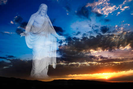 Sunset with sun and clouds in orange and golden light over mountains with Jesus as creator looking with open arms full of loveの写真素材