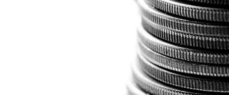 Closeup of stack of silver coins representing wealth and prosperity with white background for copyspaceの写真素材