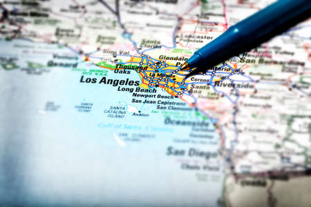Closeup map of city Los Angeles for travel destination driving with pen pointing to city