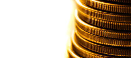 Old gold coins in a stack or pile for money cash representing wealth and riches collection goldenの写真素材