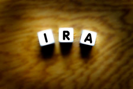 IRA spelled out with dice for retirement planning and savings investmentsの写真素材