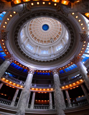 Inside looking up at columns and dome in Capitol State Capital building pillars and architectureの写真素材