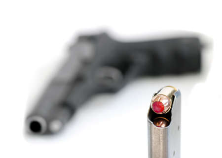 Bullets and gun for self defense or the military red tipped tipの写真素材