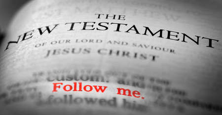 Bible New Testament Christian Teachings Gospel with the verse Follow Me in redの写真素材
