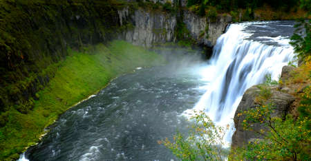 Mesa Falls waterfalls in Idaho canyon gorge water wilderness lush green plantsの写真素材