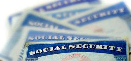 Closeup detail of several Social Security Cards representing finances and retirement penion and senior careの写真素材