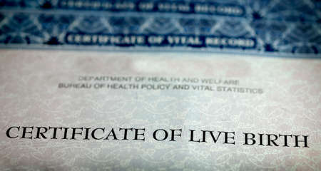Closeup of Birth Certificate official paper baby born