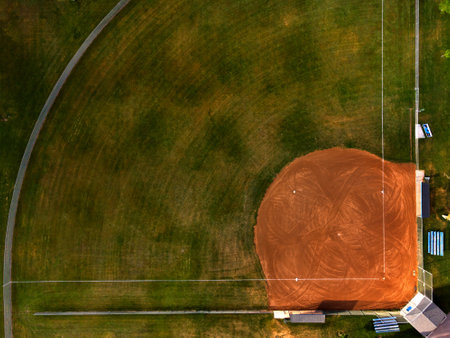 Aerial view from a drone flying above an outdoor urban baseball field diamond ball parkの写真素材