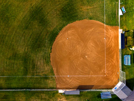 Aerial view from a drone flying above an outdoor urban baseball field diamond ball parkの写真素材
