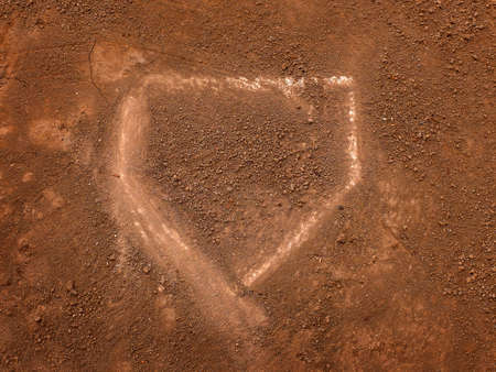 Baseball home plate in fresh dirt on a ball diamond for competition in a game scoringの写真素材