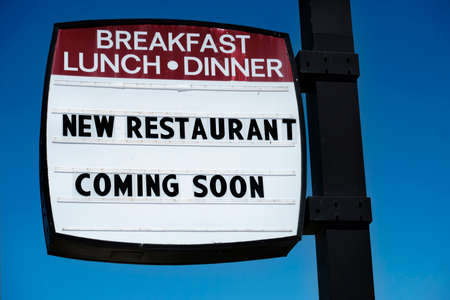 Sign for a new restaurant coming soon for breakfast lunch and dinner diner cafeの写真素材