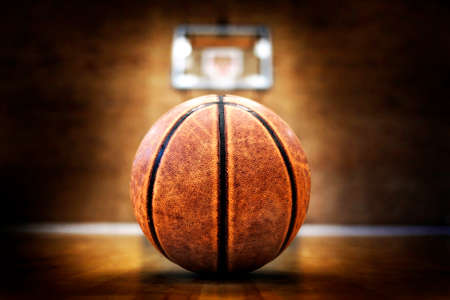 Basketball court with ball hoops rims hardwood floor and lights for competition gameの写真素材
