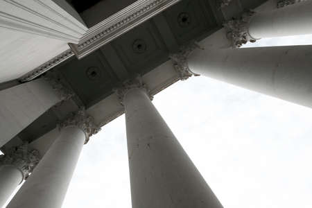 Columns of marble on a building pavilion showing architecture design and decorative structure with light and shadowsの写真素材