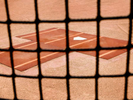 Baseball practice area fence with home plate for warm up pitchingの写真素材