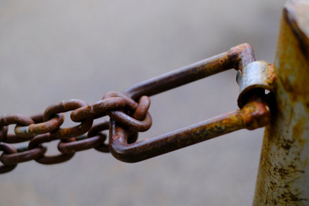 Detail of chain connected to pole for security and protectionの写真素材