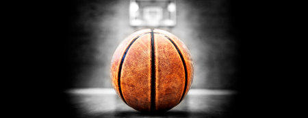 Basketball court with ball hoops rims hardwood floor and lights for competition gameの写真素材