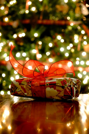 Christmas present tree decorations with tied bowの写真素材