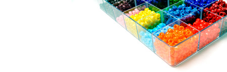 Colorful beads in bins for creating projects of artの写真素材
