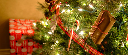 Christmas present tree decorations with tied bowの写真素材
