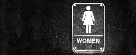Women restroom sign black dirty on bathroom doorの写真素材