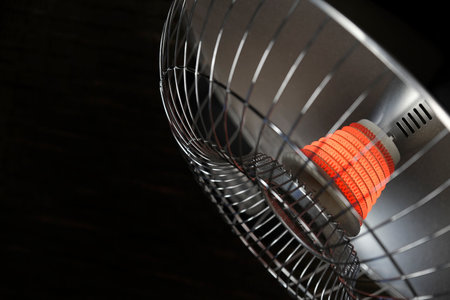 Heater with glowing red heating element for warmthの写真素材