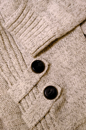 Closeup of Sweater with buttons texture of clothingの写真素材