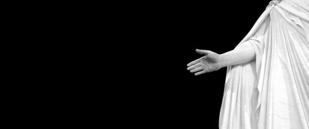 Statute of Hand of Jesus with black background nail marks from crucifiction and resurrectionの写真素材