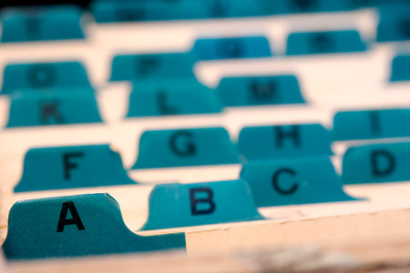 Business cards indexed and organized alphabetically for communications and contacts or leads for sales to clientsの写真素材