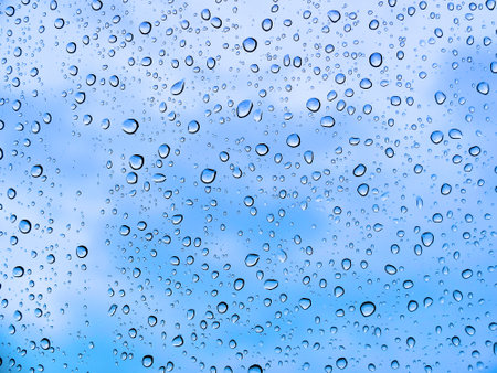Clean refreshing rain drops raindrops on window glass looking out