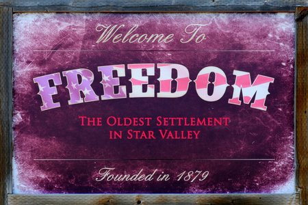 Freedom Wyoming sign weathered and worn old city sinageの写真素材