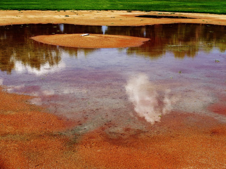 Flooded baseball diamond base ball field from rain or floodingの写真素材