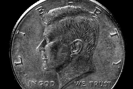 Closeup of US coins In God We Trust worn old texture silverの写真素材
