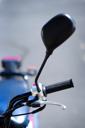 Focus and shallow depth of field on handle bars grip and rear view mirros on motorcycle for drivingの写真素材