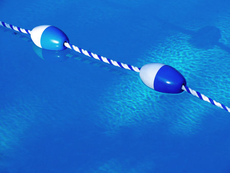 Swimming pool floating rope dividers marking lanes or areas in swimming pool
