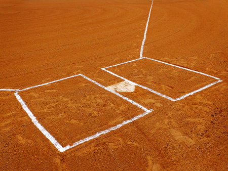 Baseball base or plat white against a dark dirt for competition and playing gameの写真素材