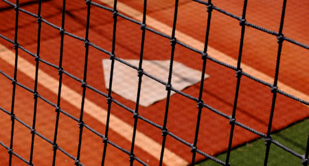 Baseball practice area fence with home plate for warm up pitchingの写真素材