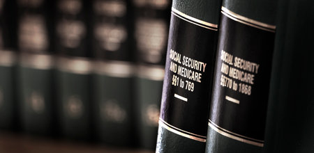 Social Security and Medicaid benefits legal law books on shelfの写真素材