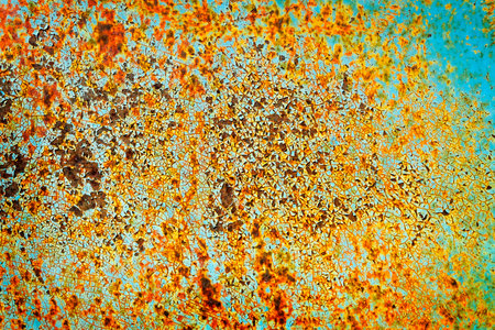 Detail of rusted metal cracked texture of old paing on steel surface