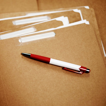 Office files on desk with pen for business work organizationの写真素材