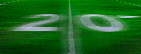 Football field green grass white yard markers to touchdown competition gameの写真素材