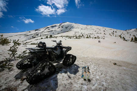 Snowmobile, snowbike, skis, winter sports in Pirin moutain Bulgariaの写真素材