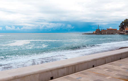 View of the sea from the promenade on a cloudy dayの写真素材
