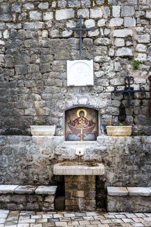Holy water fountain in the old town of Corsicaの写真素材